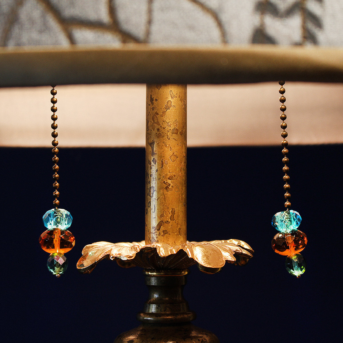 mixed media lamp finished with beaded pulls and a beaded finial.